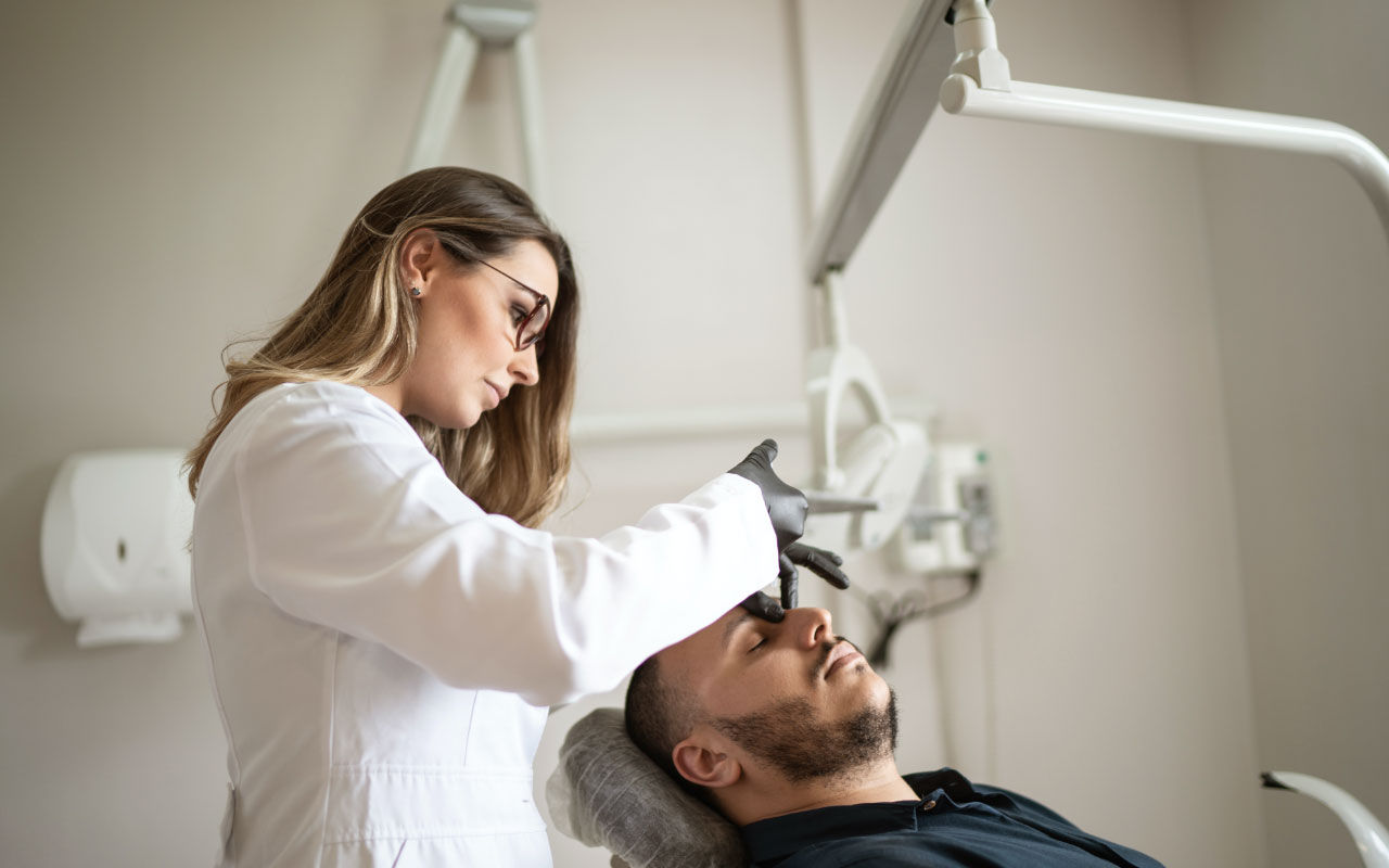 Doctor working on patient